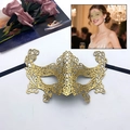 Golden lace masquerade mask with intricate cutout patterns and black elastic straps - Fox