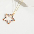 Gold star pendant necklace featuring vibrant multi-colored zircon stones inlay - Pentagram