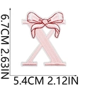 Pink embroidered letter X patch with bow detail and dimensional measurements - Bow Alphabet Letter X