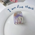 Purple and cream marble acetate hair claw clip with cutout design on ceramic plate - Metallic Purple