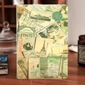 Vintage A5 notebook with retro collage cover featuring Eiffel Tower on a wooden desk - A5 / Green