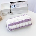 Detail of pleated lilac striped pencil case showing soft fabric texture and zipper closure - Spliced Purple