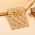 Three-piece citrine crystal woven bracelets on a craft card with product descriptions - Citrine