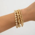 Close-up of layered gold beaded bracelets with heart charms on female wrist - Zs09 Gold 4707 / Zs Specification