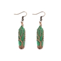 Macro detail of copper wire wrapped malachite earrings featuring the Tree of Life design - Malachite