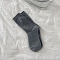 Dark gray crew socks with delicate white bow embroidery and wavy lace trim edges - Gray