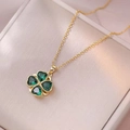Golden clover necklace set with green heart-shaped emerald zircons on silk jewelry box - X3338 Heart Emerald Rotating