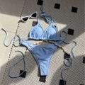Light blue bikini set featuring halter top and high-cut bottom with shell chain details - Light Blue