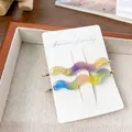 Elegant wavy acetate hair clips in purple and blue gradients with gold base - 2 Pieces/Pack (6.8cm) / Multicolor