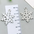 Silver enamel snowflake charm pendant with detailed metal texture for DIY jewelry making - White Snowflake 18x24mm