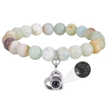 Detail view of heart pendant showing 100 languages I love you projection on beaded bracelet - Amazonite