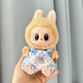 Plush doll accessory featuring Labubu in blue checkered overalls and cute bear patch - Blue And White Checkered Suspenders / First And Second Generation Keychains Are Compatible With La Cloth Dolls. Dolls Not Included.