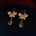 Detail of butterfly zircon earrings with yellow teardrop pendants on a dark surface - 37# Ear Hook-Yellow-Bowknot