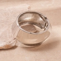 Polished silver metal wide cuff bracelet with a spring hinge mechanism on a natural stone - Silver