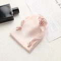 Elegant light pink satin drawstring pouch for cosmetic storage and gift packaging - Champagne Pink