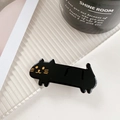 Cute black cat acetate hair clip on a minimalist tray for styling short hair - Black