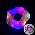 Purple LED satin scrunchie glowing with multicolor lights against a dark background - Glowing Light Purple