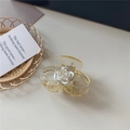 Translucent yellow hair claw clip featuring a 3D pearlescent white camellia flower accent - Double C Flower