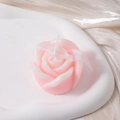 Close-up of a pink gradient rose-shaped scented candle on an elegant white tray - Gradient Pink