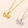 Minimalist gold and silver FUCK OFF letter pendant necklaces on beige fabric - Necklace / Gold