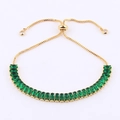 Adjustable gold tennis bracelet featuring emerald green rectangular zircon stones - Slider Clasp Gold-Green
