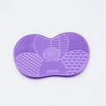 Macro shot of purple silicone brush cleaning mat with various texture patterns for deep washing - Small Apple Shape / Purple