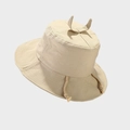 Detail view of beige canvas bucket hat featuring cute horn accents and braided chin strap - Beige