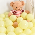 Pastel yellow latex balloon set for birthday party decorations in cozy nursery scene - 5 Inch Macaron Yellow