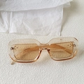 Detailed top view of pale yellow square sunglasses with stylish metal rivets on the frame - Champagne
