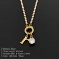 Stainless steel necklace with letter R and sparkling rhinestone pendants in gold finish. - Letter R (XNL0103)