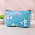 Blue floral printed PU leather makeup bag with custom text on a pink background - Lake Blue Pastoral Flower