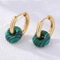 Detail of gold hoops with green striped malachite stone charms on white background - Turquoise