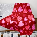 Detail of red flannel blanket with heart patterns draped on a grey sofa - Style 57 (Red Hearts Mix)