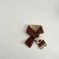 Close-up of brown knit scarf featuring a cute 3D bear decoration and soft texture - Scarf / Brown