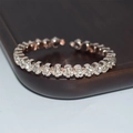 Macro view of rose gold adjustable bracelet with sparkling row of white crystals - Rose Gold