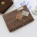 Brown cashmere-feel scarf with tassels and label, styled on white table with accessories - Dark Mocha / 200cm