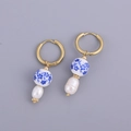 Detail of blue and white porcelain beads with baroque pearls on gold hoop earrings - Porcelain Bead Pearl