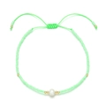 Detail of light green seed bead bracelet with a central freshwater pearl and adjustable cord - Light Green (QQ397A)