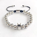 Detail of silver crown bead bracelet featuring black braided rope and metallic beads - Round Beads Braided Crown Silver