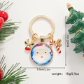 Détail du porte-clés de Noël avec pendentif Père Noël, renne doré et sucre d'orge rouge - Père Noël à grosse tête