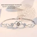 Silver heart bracelet with micro-carved stone projecting I Love You in 100 languages - Silver (Platinum Plated)