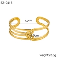 Detail view of gold stainless steel cuff bracelet with 6.2cm inner diameter and 2.0cm width - Gold Intertwined Lines (BZ1041B)