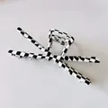 Detailed view of a large black and white checkerboard hair claw clip with silver spring - 8# Black and White Plaid Metal Claw Clip
