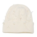 Detail of distressed knit beanie featuring chunky cream yarn with ripped holes and tassels - M (56-58cm) / Beige
