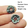 Detailed macro view of 16mm antique silver alloy flower spacers for DIY jewelry making - 16#