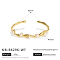 Macro shot of wavy gold pearl bracelet with stainless steel dimensions and specifications - White Bead (NB-B6296-WT)