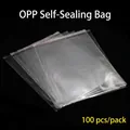 Bolsas transparentes autoadhesivas OPP para ropa, paquete de 100 con tira de cierre roja - 20*30+3cm (100 Unidades/Paquete)