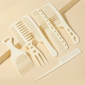 Close-up of a 6-piece professional beige styling hair comb set for various hair textures - Off White