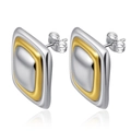 Detailed macro view of two-tone square stud earrings in polished silver and gold finish - Bi-color Gold Silver Square