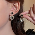 Elegant gold double-layered hoop earrings with black center stone and white crystals - Gold Black